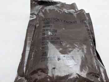 MCI Accessory Packet, With Cigarettes, Opened MCI Accessory Packet, With Cigarettes, Opened